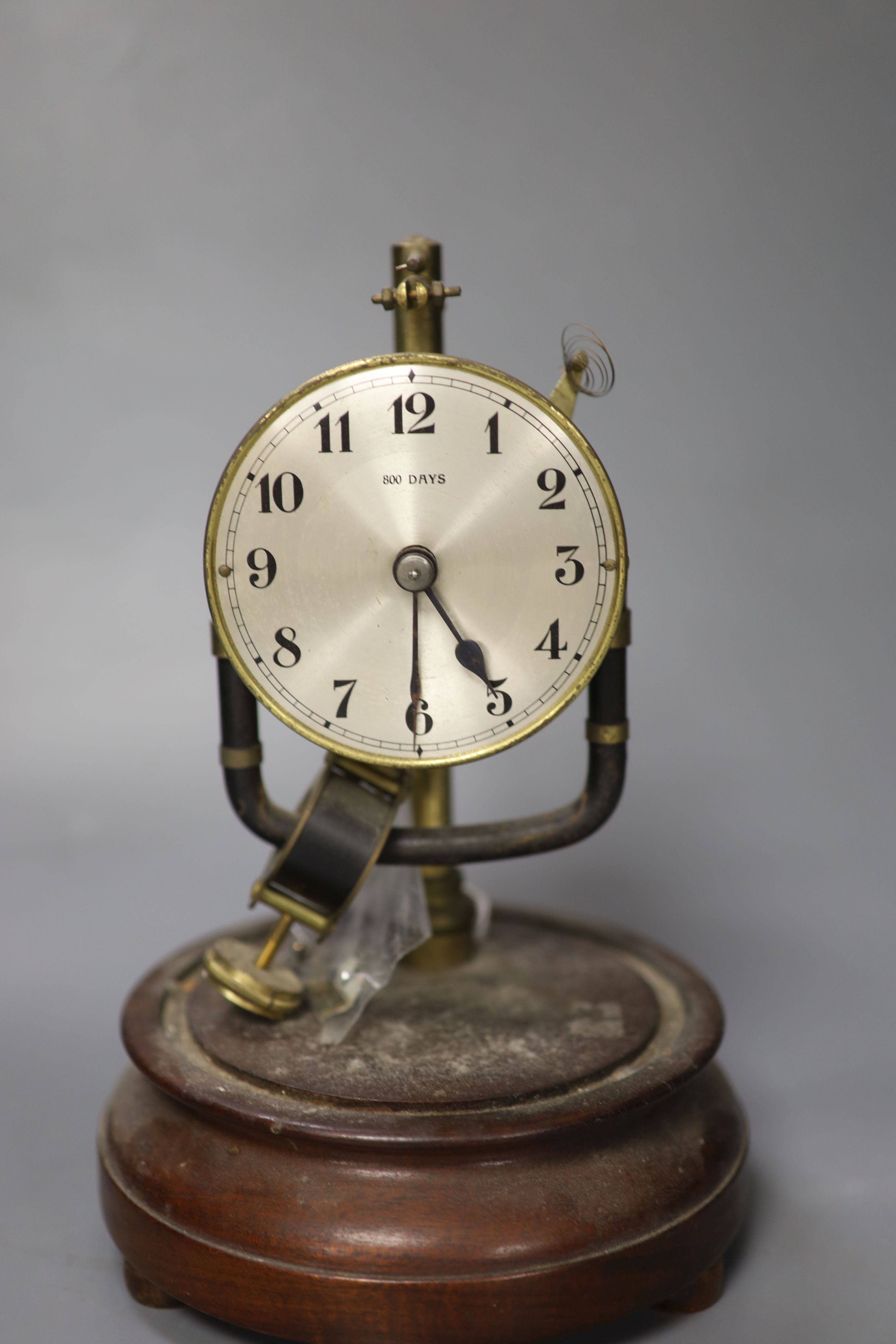 A Bulle electric mantel clock, under a glass dome, 25cm high